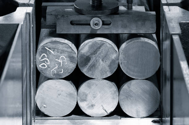 istock Automatic bandsaw sawing metal workpiece, industrial concept background 1323554266