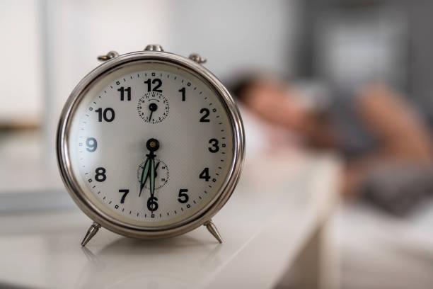 istock Alarm clock early in the morning. Time or waking up. 1323554433