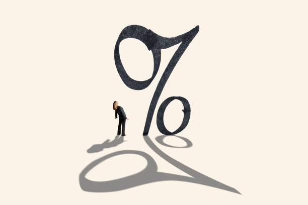istock Woman Looking Up At Large Interest Rate Symbol 1323554442