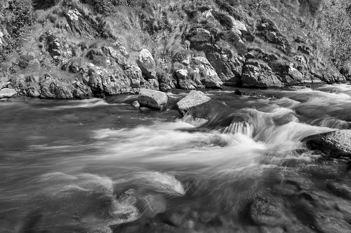 Long exposure of the River Heddon flowing into Heddons Mouth on the north Devon coast