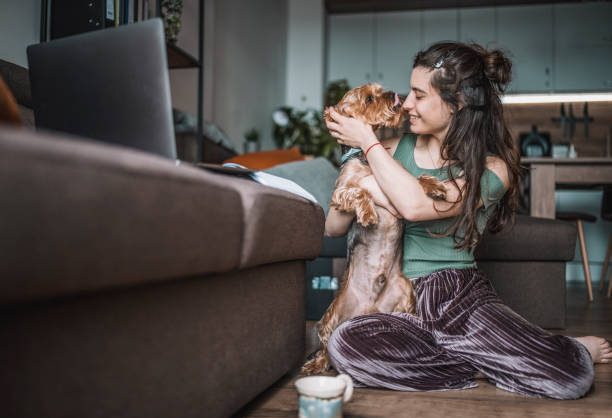 istock Woman playing with her dog 1323558355
