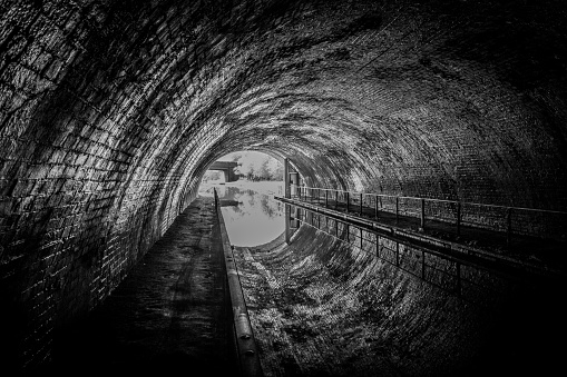 Optical illusion inside a canal tunnel, looking out