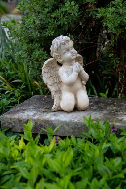 istock small angel on a cemetery grave 1323561386