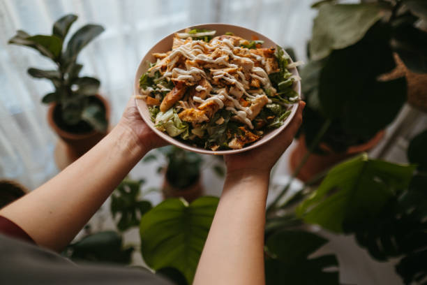 istock Holding a bowl of chicken salad 1323564910