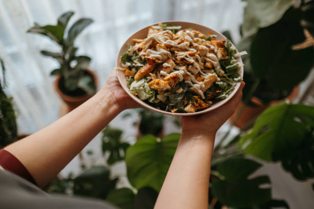 istock Holding a bowl of chicken salad 1323564931