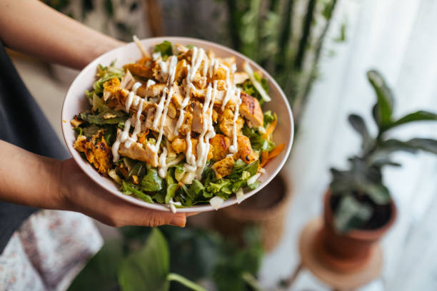 istock Holding a bowl of chicken salad 1323564969