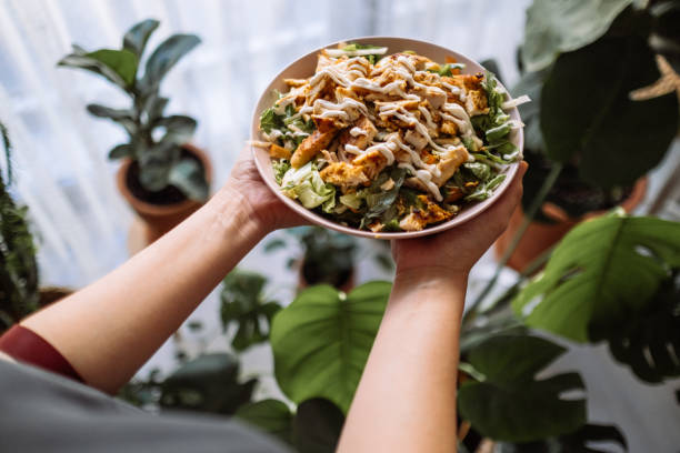 istock Holding a bowl of chicken salad 1323565005