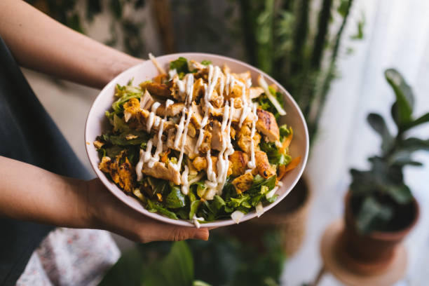 istock Holding a bowl of chicken salad 1323565029