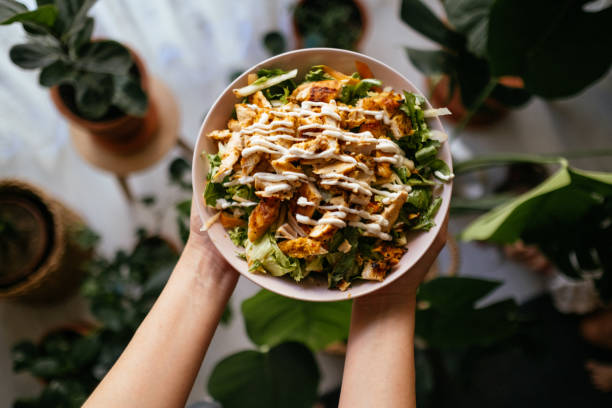 istock Holding a bowl of chicken salad 1323565052