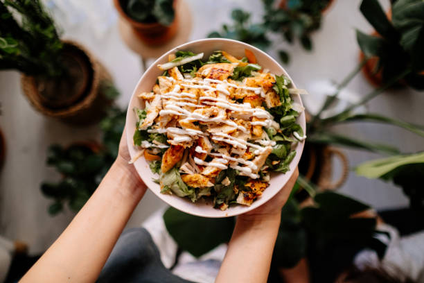 Holding a bowl of chicken salad