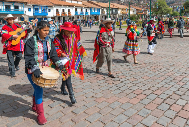 Inti Raymi Celebrations, Cusco, Peru Cusco, Peru - June 24, 2013: Peruvian people walking in traditional clothing during Inti Raymi sun festival celebrations with music instruments, Cusco, Peru. inti raymi stock pictures, royalty-free photos & images