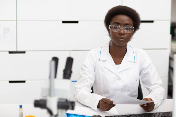 istock Scientist african american woman working in laboratory with electronic instruments 1323566976