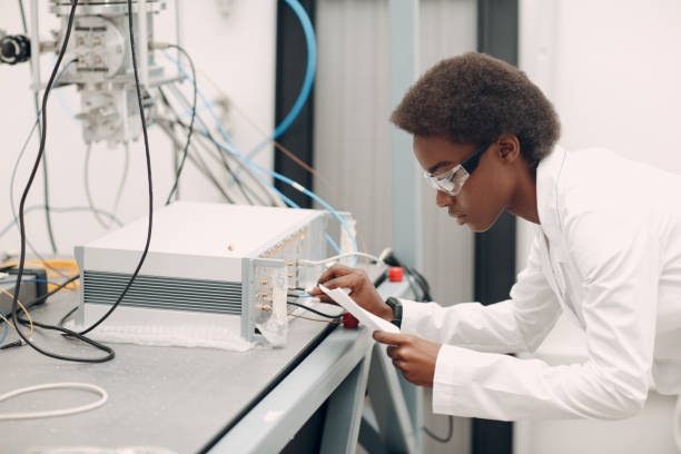 istock Scientist african american woman working in laboratory with electronic instruments 1323566981