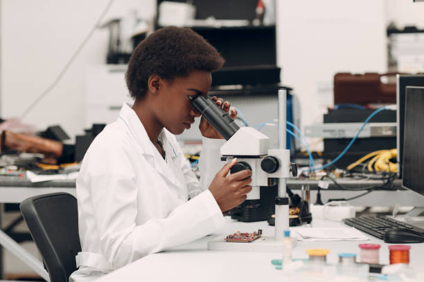 istock Scientist african american woman working in laboratory with electronic instruments 1323567308