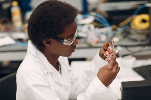 istock Scientist african american woman working in laboratory with electronic instruments 1323567414