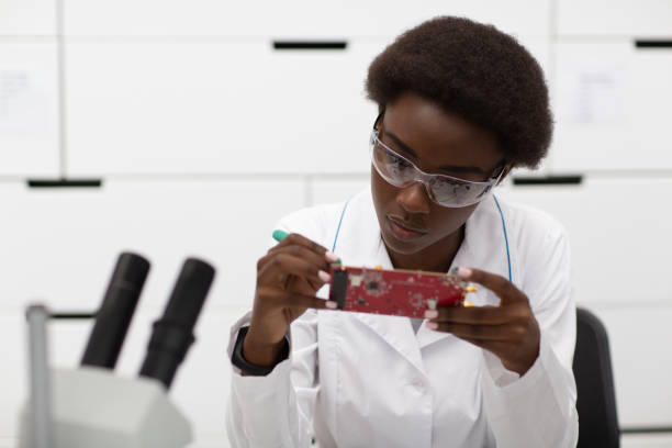 istock Scientist african american woman working in laboratory with electronic instruments 1323567415