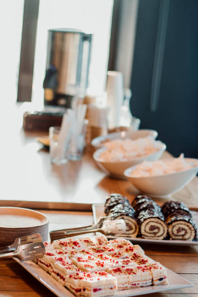 Delicious cakes on the catering table. Small pieces of cake. Coffee break.