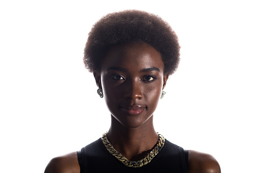Close up full face portrait of black african american woman with afro hairstyle on white studio background.
