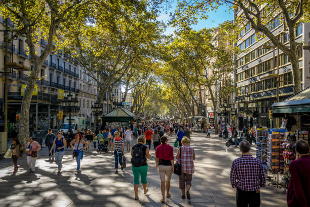 Barcelona Catalonia Spain October 2015 The Ramblas.  People stroll through the Ramblas shopping and enjoying a beautiful day in Barcelona Catalonia Spain October 2015 la rambla stock pictures, royalty-free photos & images