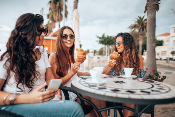 istock friends doing breakfast at the cafe 1323573134