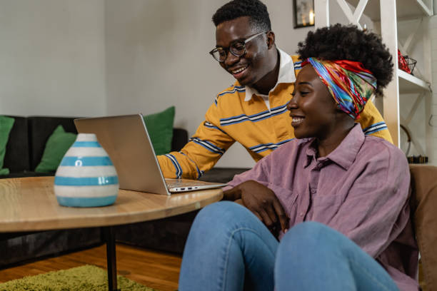 istock A young couple uses laptop at home 1323574007