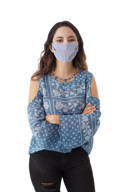istock Happy woman wearing protective face mask 1323577009