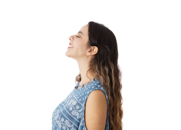 istock Happy young woman smiling with eyes closed 1323578227