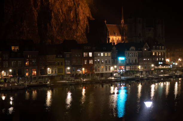 istock Small Belgian town Dinant on Meuse river in Walloon, Belgium at night 1323578680
