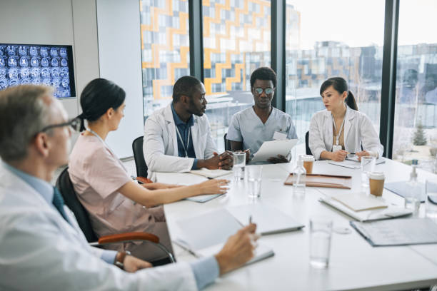 istock Multi Ethnic Doctors Speaking at Medical Council 1323582819
