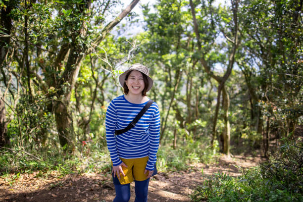 istock Happy young woman hiking 1323583470