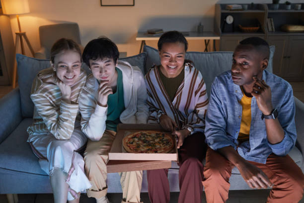 istock Friends Enjoying Movie Night 1323584210