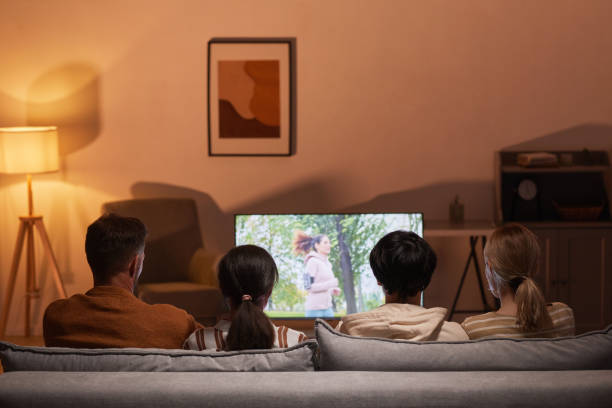 istock Friends Enjoying TV Night 1323584214