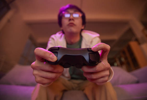 ビデオゲームをしている若者 - gamer video game video computer ストックフォトと画像