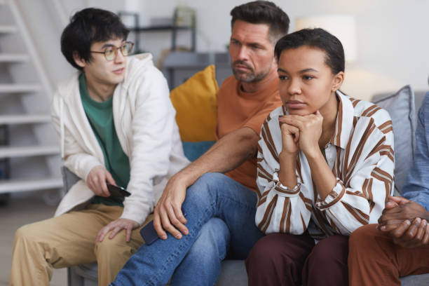 istock People Watching TV at Home 1323584225