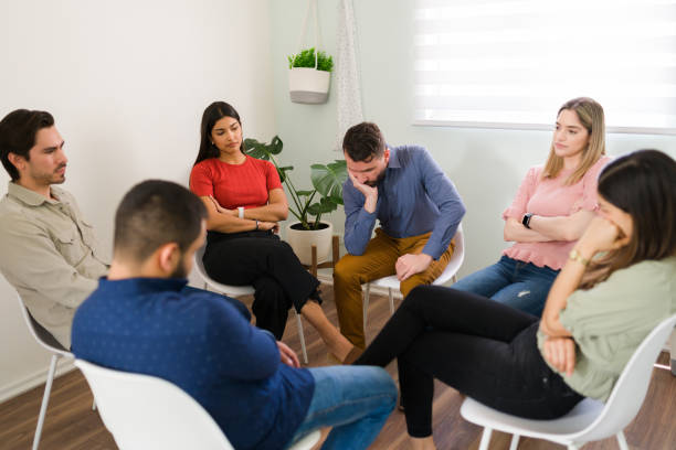 istock Sad young men and women attending counseling 1323585102
