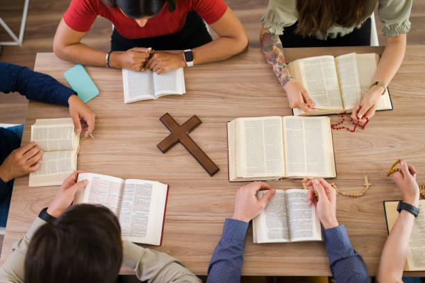 istock Diverse women and men saying their prayers 1323586900