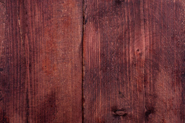 istock The texture of the board is red. Background with a blank space for text or collage. Structure of a tree covered with a protective compound 1323588927