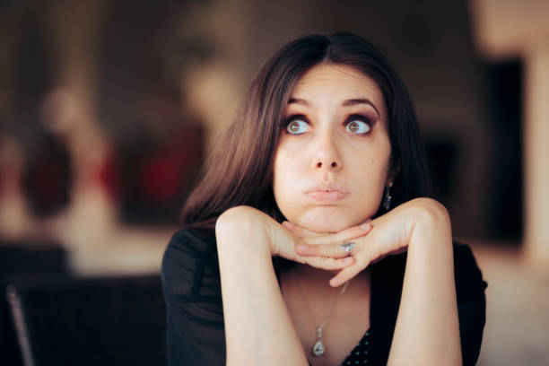 istock Worried Woman Looking Up Feeling Concerned and Stressed Out 1323589959