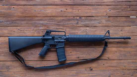 Military-style AR-15 “assault rifle” with scope.