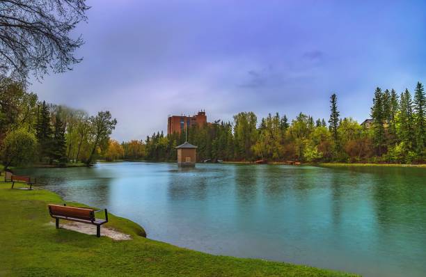 istock Cloudy Sky Over A Lake In A Spring Park 1323605371