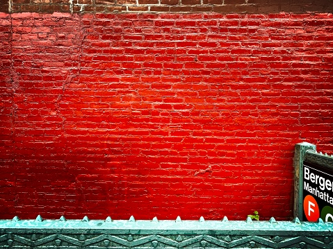 Subway Entrance with a Red Wall