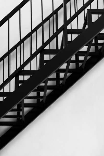istock metal black stair architecture white wall background 1323607179