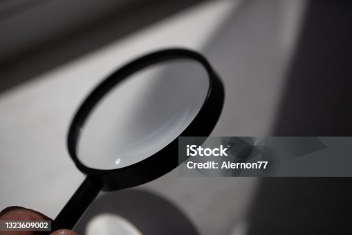istock Magnifying glass with find illustrations and keyboard 1323609002