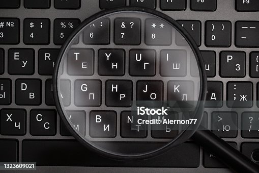istock Magnifying glass with find illustrations and keyboard 1323609021