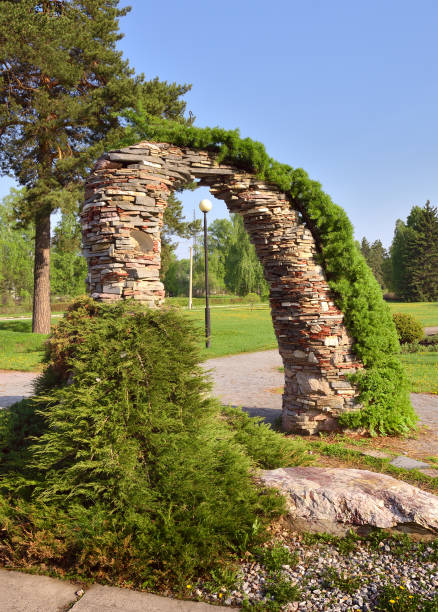 istock Garden arch made of stones 1323609879