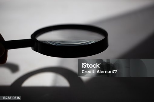 istock Magnifying glass with find illustrations and keyboard 1323610516
