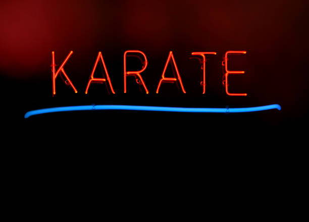 istock Neon Martial Arts Sgn in School Window Karate 1323610973