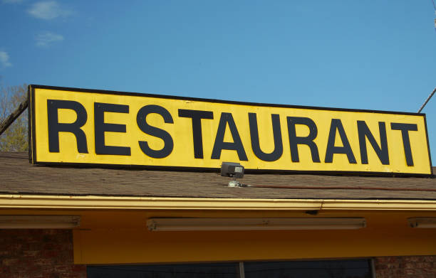 istock Restaurant Sign Outdoors On Building Roof With Blue Sky 1323611623