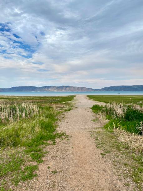 Dirt and Gravel Path Leading to Shore of Bear Lake in Garden City, Utah stock photo