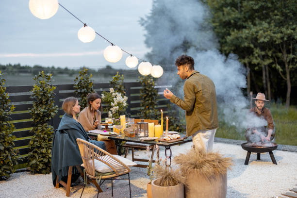 istock Friends dining at the backyard in the evening 1323613598